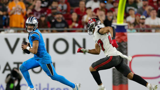 Carolina Panthers quarterback Bryce Young (9) is chased by Tampa Bay Buccaneers cornerback Zyon McCollum (27) in the fourth quarter at Raymond James Stadium.