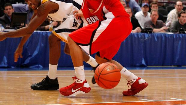 Davidson Wildcats guard Stephen Curry reaches for a loose ball.