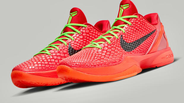 Side view of Kobe Bryant's red and green Nike sneakers.