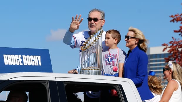 Nov 3, 2023; Arlington, TX, USA; Texas Rangers manager Bruce Bochy waves with the championship trophy during the World Series championship parade at Globe Life Field. Mandatory Credit: Andrew Dieb-USA TODAY Sports
