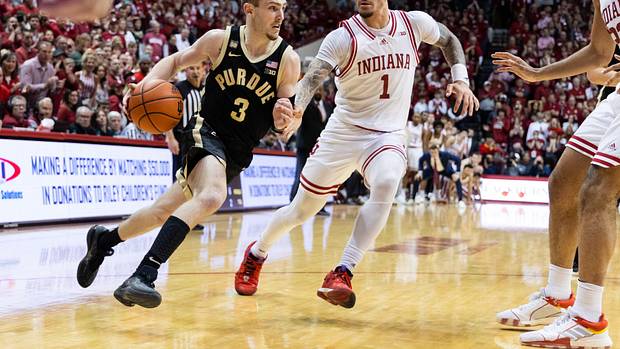 Purdue Boilermakers guard Braden Smith (3) dribbles the ball while Indiana Hoosiers guard Jalen Hood-Schifino (1) defends in the second half at Simon Skjodt Assembly Hall.