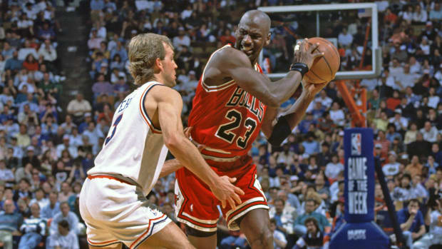 Chicago Bulls superstar Michael Jordan defended by Cleveland Cavaliers' Craig Ehlo at Richfield Coliseum