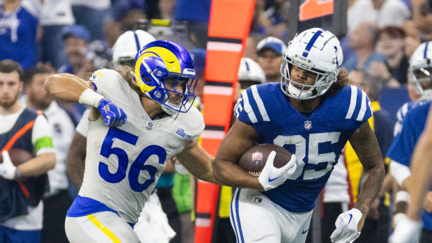 Oct 1, 2023; Indianapolis, Indiana, USA; Indianapolis Colts tight end Drew Ogletree (85) runs with the ball while Los Angeles Rams linebacker Christian Rozeboom (56) defends in the second half at Lucas Oil Stadium. Mandatory Credit: Trevor Ruszkowski-USA TODAY Sports