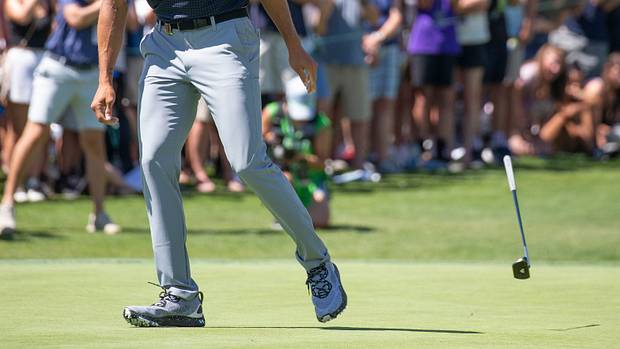 Stephen Curry celebrates on the golf course.