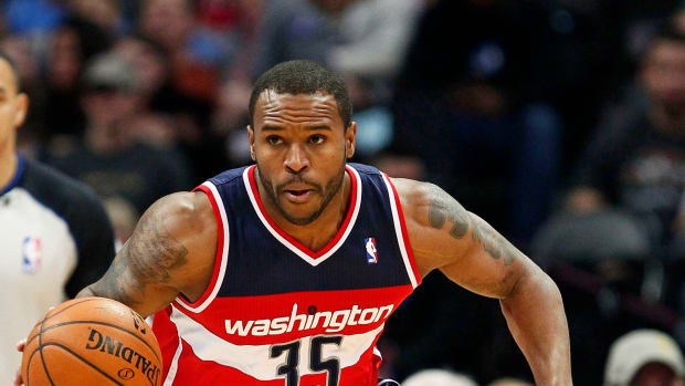Washington Wizards power forward Trevor Booker dribbles the ball in the first quarter against the Denver Nuggets at the Pepsi Center.