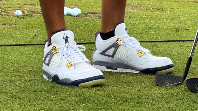 View of Derek Jeter's white and grey Air Jordan golf shoes.