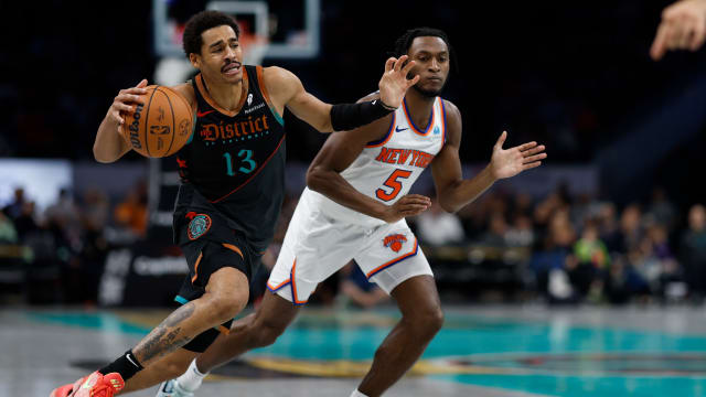 Washington Wizards guard Jordan Poole (13) drives to the basket as New York Knicks guard Immanuel Quickley (5) defends in the third quarter at Capital One Arena.
