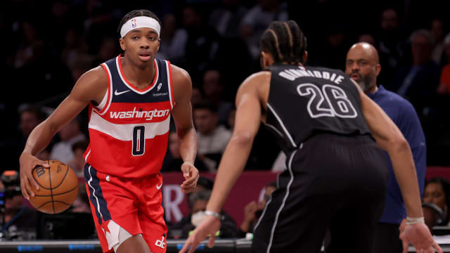Dec 8, 2023; Brooklyn, New York, USA; Washington Wizards guard Bilal Coulibaly (0) controls the ball against Brooklyn Nets guard Spencer Dinwiddie (26) during the fourth quarter at Barclays Center.