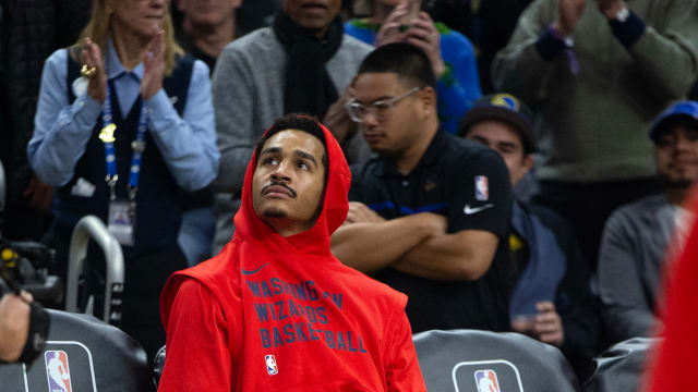 Washington Wizards guard Jordan Poole watches a tribute to him on the big screen by his former team, the Golden State Warriors before the start of their game at Chase Center.