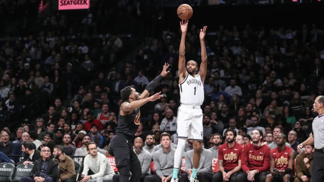 Brooklyn Nets forward Mikal Bridges (1) shoots a three-point basket over Cleveland Cavaliers guard Donovan Mitchell (45)