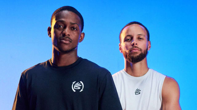 De'Aaron Fox and Stephen Curry pose for a picture in a photo shoot.