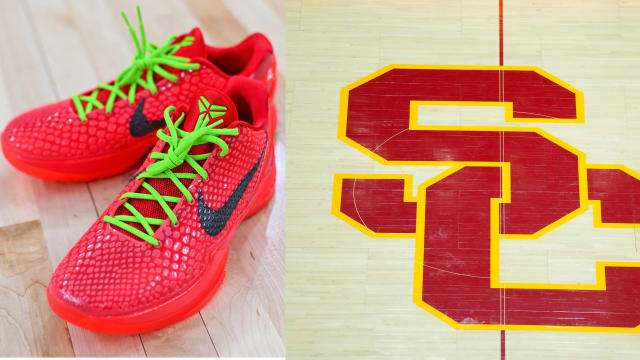 Kobe Bryant's red and green Nike sneakers on the USC Trojans basketball court.