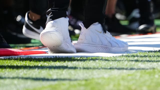 View of Colorado Buffaloes head coach Deion Sanders' white Nike shoes during a game.