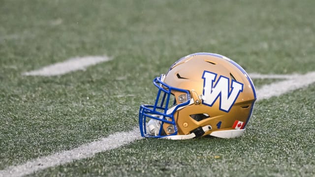 Jul 1, 2023; Montreal, Quebec, CAN; Winnipeg Blue Bombers helmet laying on the field during warm-up before the game against the Montreal Alouettes at Percival Molson Memorial Stadium. Mandatory Credit: David Kirouac-USA TODAY Sports