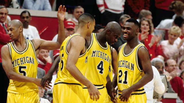 The 1993 Michigan Wolverines basketball team during a timeout.