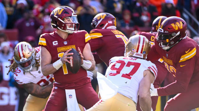Washington Commanders quarterback Sam Howell (14) drops back to pass against the San Francisco 49ers during the first half at FedExField. Mandatory Credit: Brad Mills-USA TODAY Sports