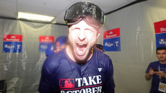 Oct 4, 2023; St. Petersburg, Florida, USA; Texas Rangers starting pitcher Max Scherzer (L) celebrates in the locker room after defeating the Tampa Bay Rays in game two of the Wildcard series for the 2023 MLB playoffs at Tropicana Field. Mandatory Credit: Nathan Ray Seebeck-USA TODAY Sports  