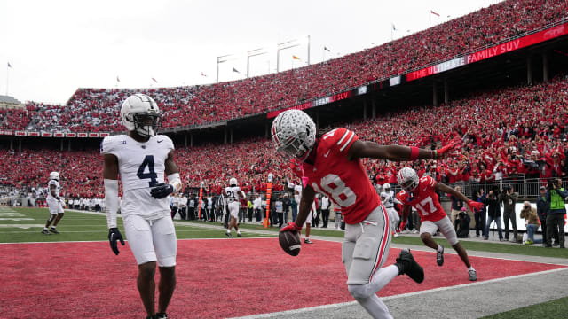 Ohio State Buckeyes wide receiver Marvin Harrison Jr. (18) celebrates a touchdown catch against Penn State Nittany Lions during the fourth quarter of their game at Ohio Stadium