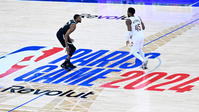 Cleveland Cavaliers guard Donovan Mitchell dribbles against Brooklyn Nets forward Mikal Bridges.