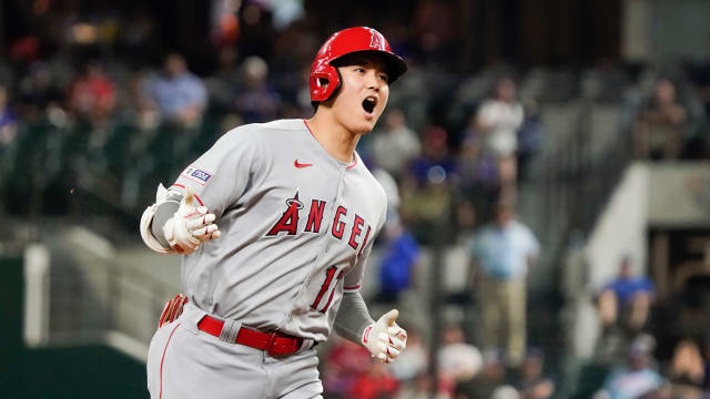 Jun 12, 2023; Arlington, Texas, USA; Los Angeles Angels designated hitter Shohei Ohtani reacts as he rounds the bases after hitting a two-run go-ahead home run during the twelfth inning against the Texas Rangers at Globe Life Field