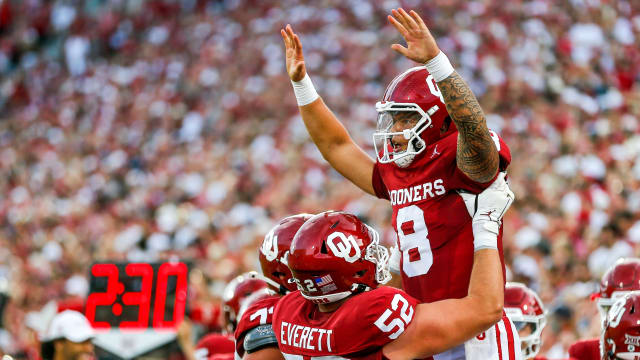 Oklahoma's Dillon Gabriel (8) celebrates scoring a touchdown with Oklahoma s Troy Everett (52) in the first quarter during an NCAA football game between University of Oklahoma (OU) and Iowa State