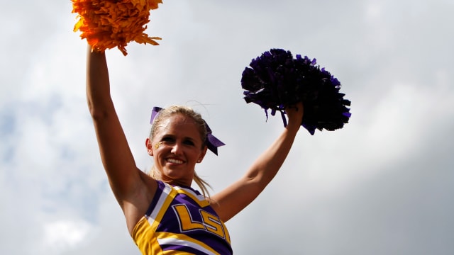 LSU Tigers cheerleader at a college football game in the SEC.