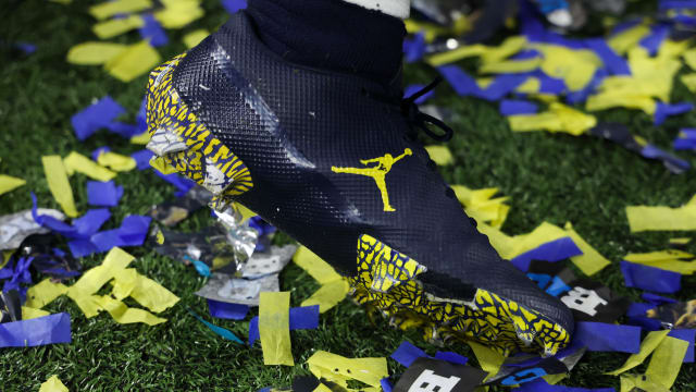 A Michigan Wolverines' football players' navy Jordan Brand cleats.