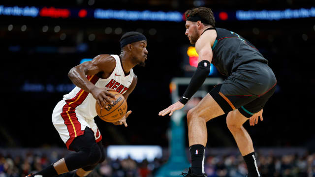 Miami Heat forward Jimmy Butler (22) drives to the basket as Washington Wizards forward Corey Kispert (24) defends in the first half at Capital One Arena. Mandatory Credit: Geoff Burke-USA TODAY Sports