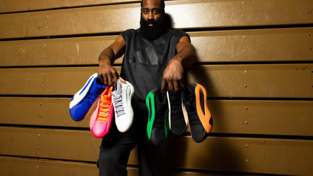 James Harden holds six pairs of his multicolor adidas basketball shoes.