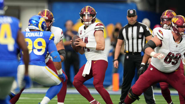 Washington Commanders quarterback Sam Howell (14) throws the ball against the Los Angeles Rams in the first half at SoFi Stadium.