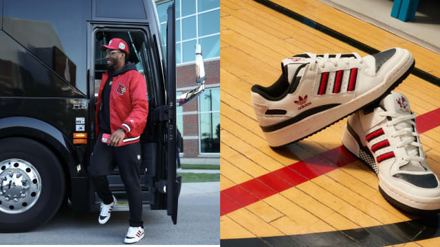 Donovan Mitchell wearing adidas sneakers to a Louisville Cardinals football game.