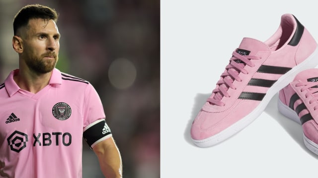 Lionel Messi next to his pink and black adidas sneakers.