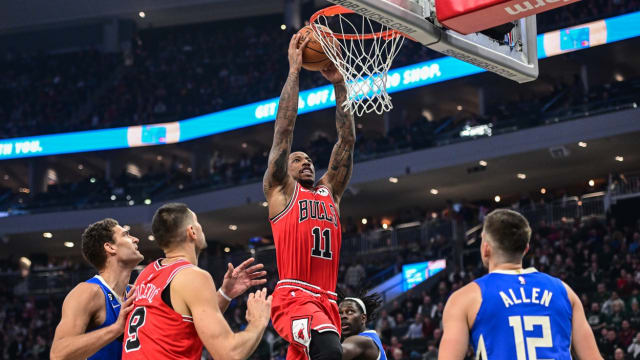 Chicago Bulls forward DeMar DeRozan (11) dunks a basket against Milwaukee Bucks center Brook Lopez (11) in the first quarter