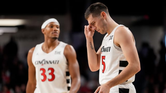 Cincinnati Bearcats guard CJ Fredrick (5) rubs his eye after being hit in the face in the first half of the NCAA men s basketball exhibition game between the Cincinnati Bearcats and the Detroit Mercy Titans at Fifth Third Arena in Cincinnati on Friday, Nov. 10, 2023. The Bearcats took a 60-27 lead into halftime.