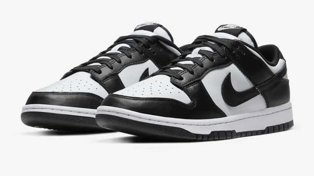 View of white and black Nike Dunk shoes.