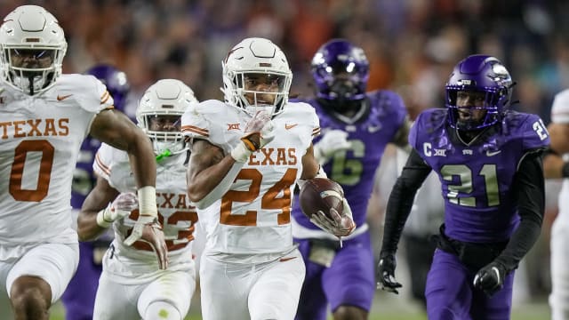 Texas Longhorns running back Jonathon Brooks (24) runs for the first down against TCU Horned Frogs in the first quarter of an NCAA college football game, Saturday, November. 11, 2023, at Amon G. Carter Stadium