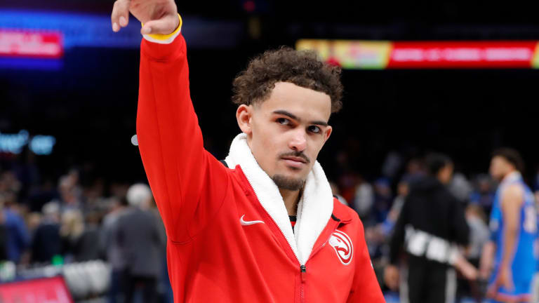Trae Young Gives Game-Worn Shoes to Fans in Oklahoma City