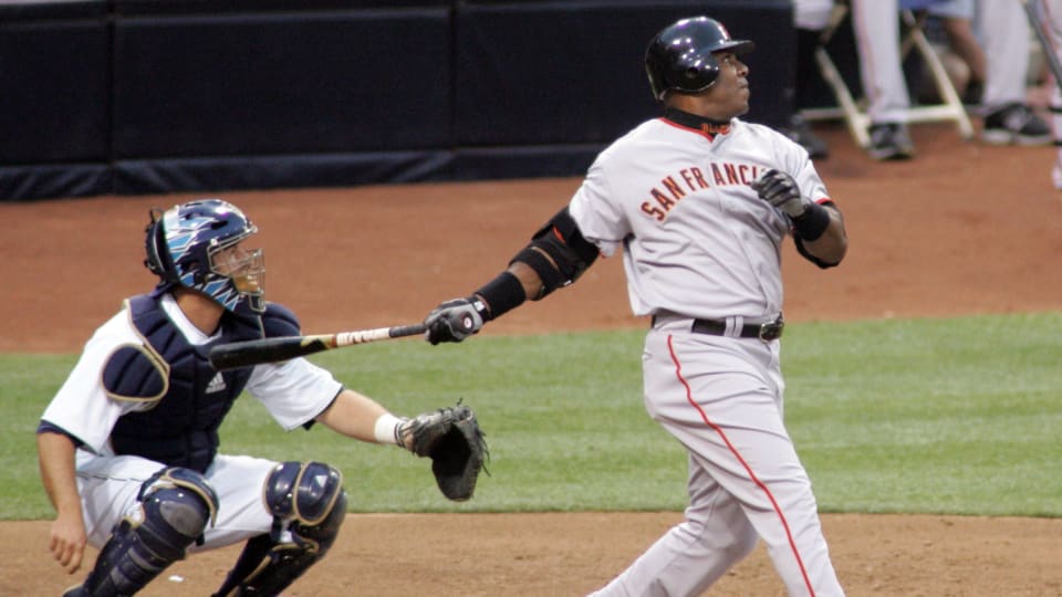 SF Giants left fielder watches a ball after he hit a home run. (2007)