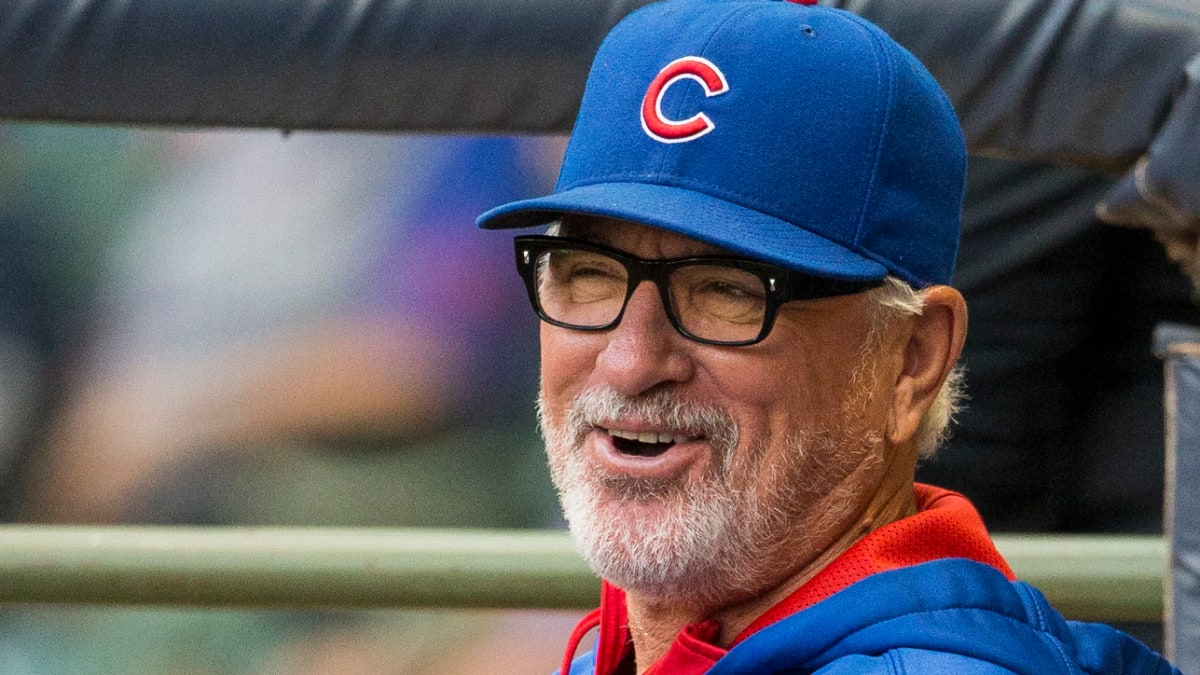 Cubs manager Joe Maddon shows off a new pink fundraising T-shirt