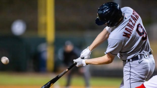 Kyle Manzardo swings at a pitch while representing the Cleveland Guardians in the Arizona Fall League.