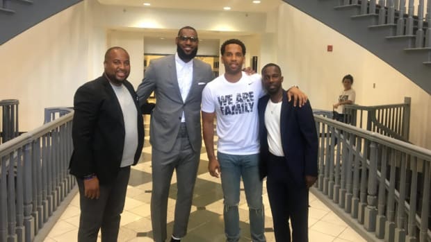 LeBron James (second left) and longtime friends (from left) Randy Mims, Maverick Carter and Rich Paul.