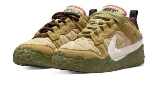 Tan and green Nike Dunk shoes.