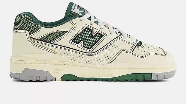 Side view of tan and green New Balance sneakers.