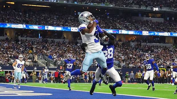 Brandin Cooks (3) scores one of Dallas' seven touchdowns on Sunday afternoon