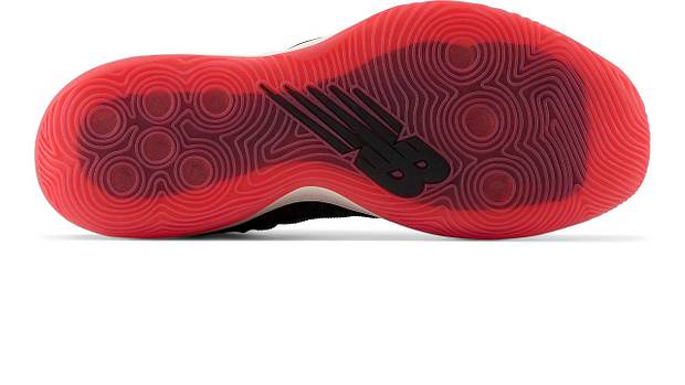 Red outsole of New Balance shoe.