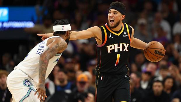 Phoenix Suns guard Devin Booker (1) reacts against the Minnesota Timberwolves in the first half at Footprint Center.