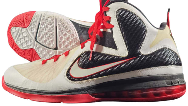 View of white, navy, and red Nike LeBron shoes.