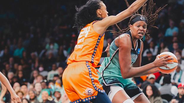 Jonquel Jones (R) earned yet another double-double in Sunday afternoon's Finals berth-clinching victory.
