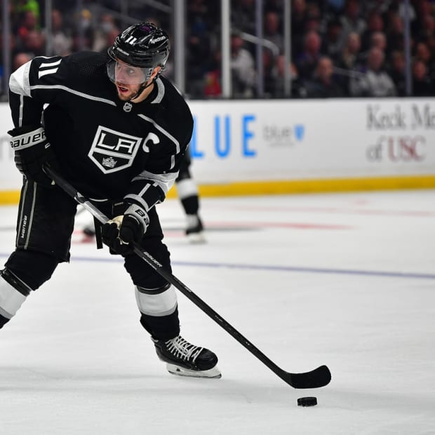 May 12, 2022; Los Angeles, California, USA; Los Angeles Kings center Anze Kopitar (11) controls the puck against the Edmonton Oilers during the second period in game six of the first round of the 2022 Stanley Cup Playoffs at Crypto.com Arena. Mandatory Credit: Gary A. Vasquez-USA TODAY Sports