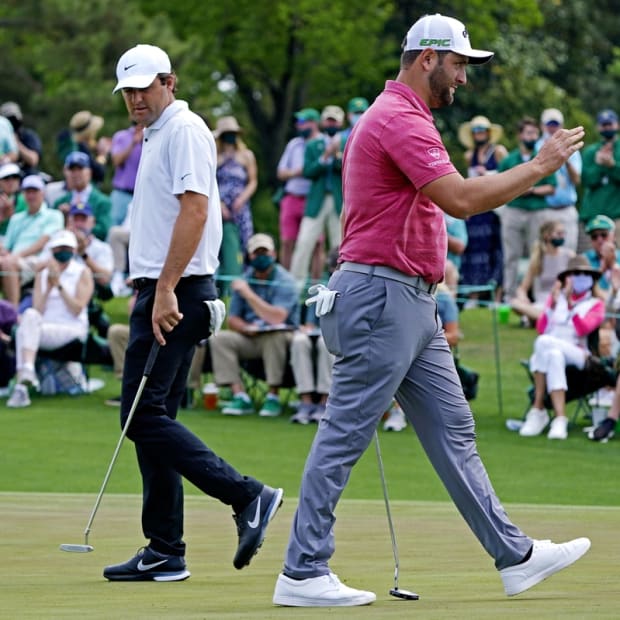 Apr 11, 2021; Augusta, Georgia, USA; Jon Rahm reacts to his putt on the second green as Scott Scheffler looks on during the final round of The Masters golf tournament. Mandatory Credit: Michael Madrid-USA TODAY Sports